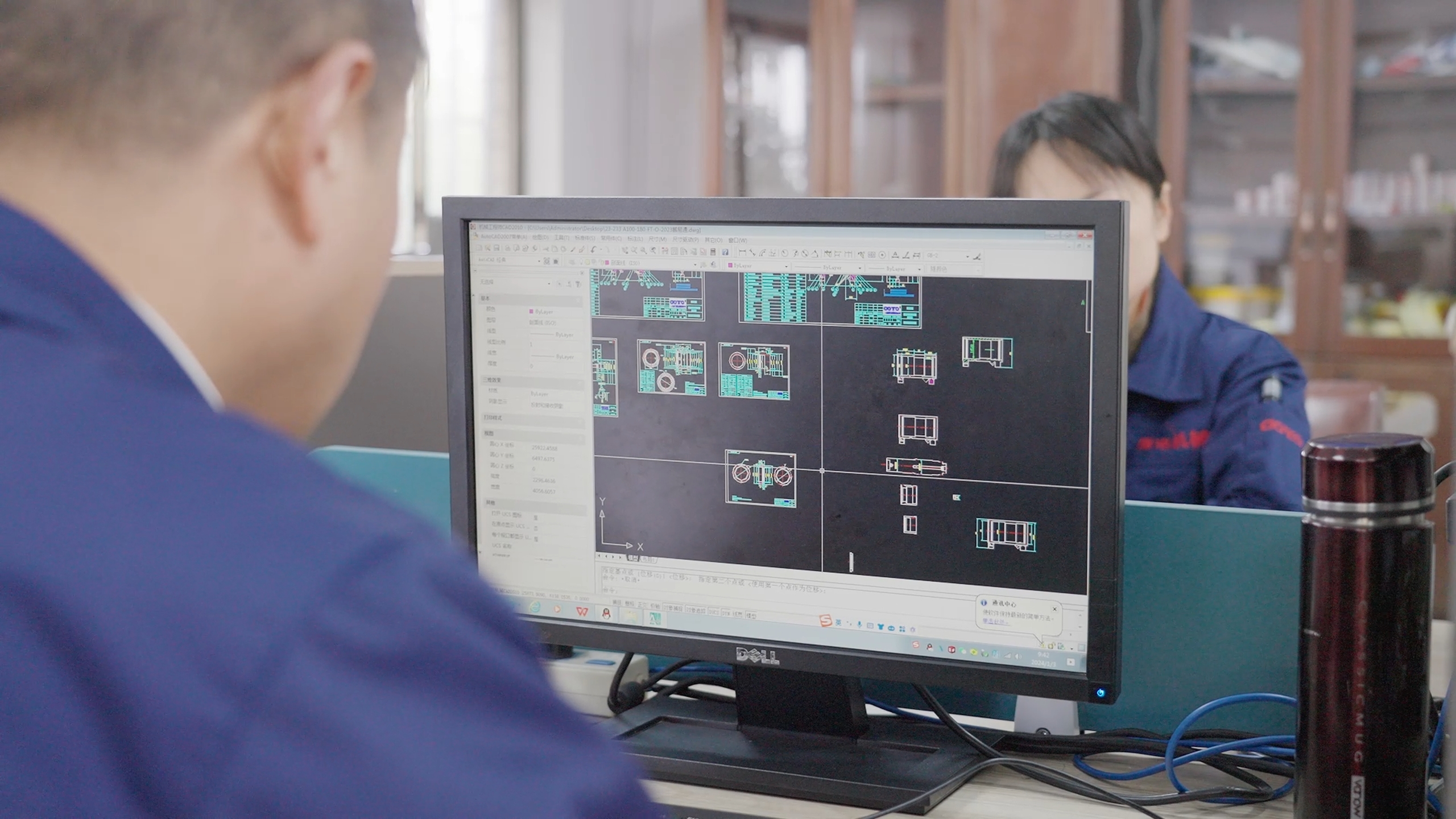 Engineer reviewing rotary actuator CAD design