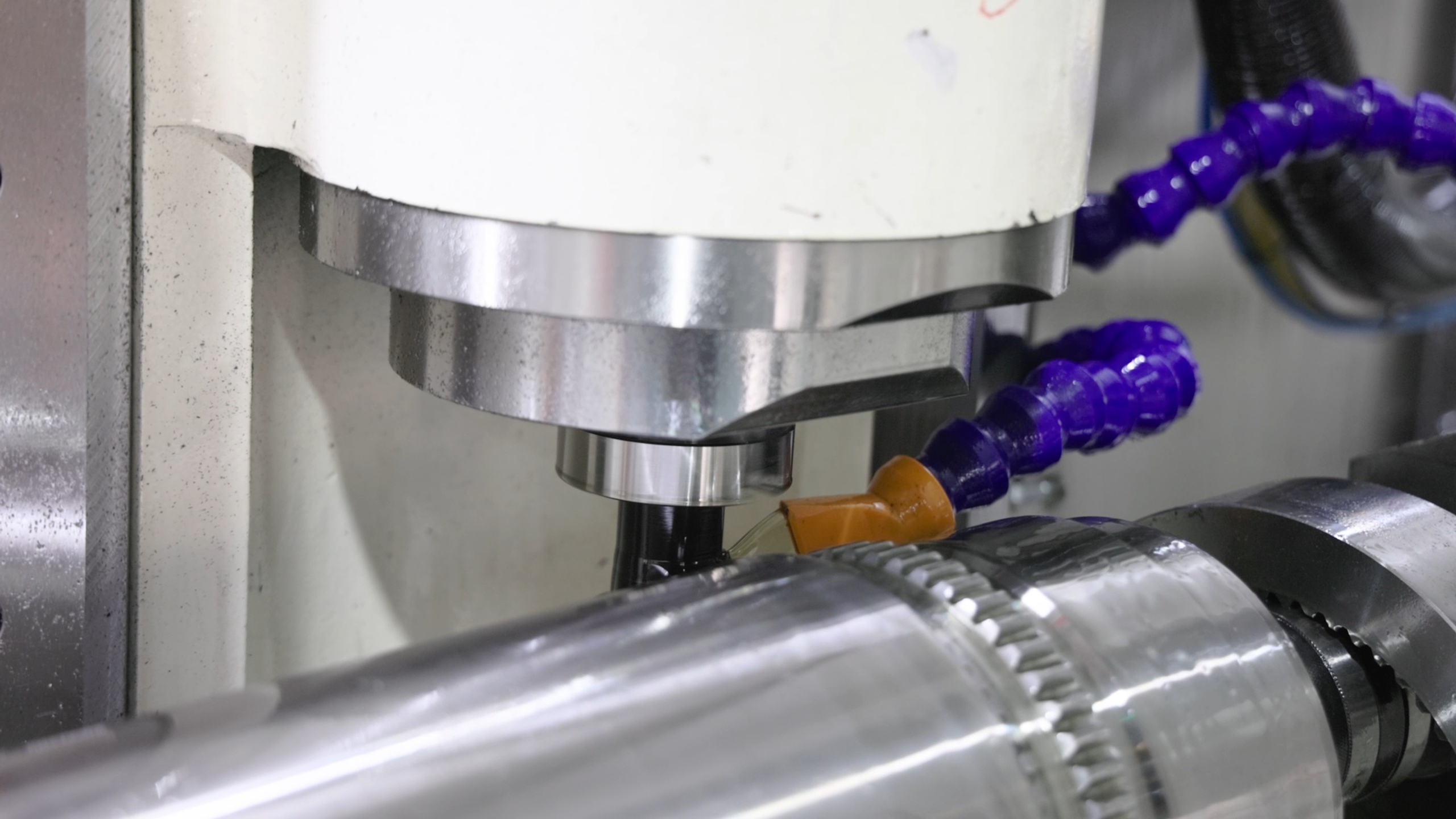 Five-axis CNC machining of a rotary actuator part